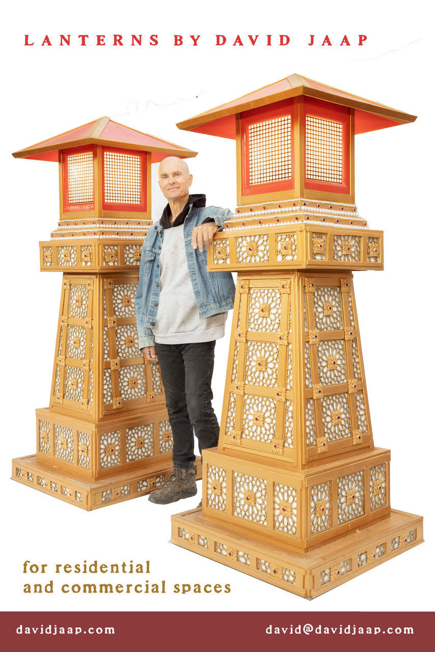 David standing between two lanterns